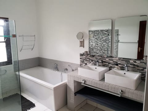 Designer toiletries, hair dryer, towels