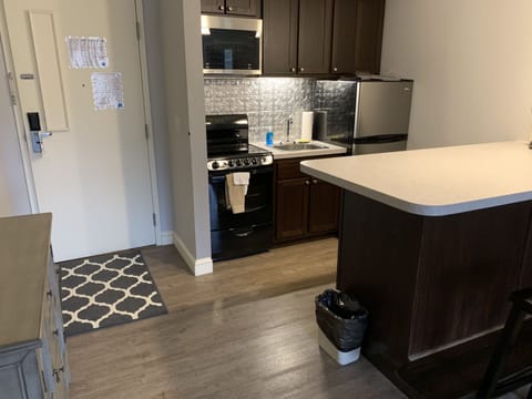 Exclusive Suite, Multiple Beds, Fireplace | Private kitchen | Mini-fridge, microwave, coffee/tea maker, freezer