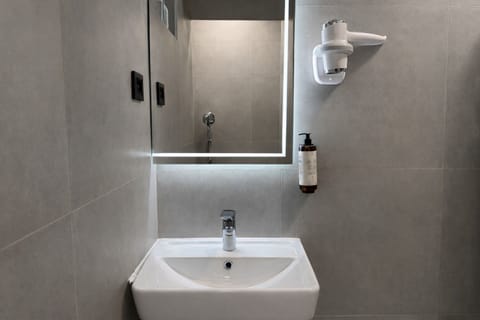 Shower, free toiletries, hair dryer, slippers