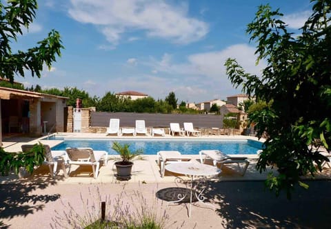 Seasonal outdoor pool, open 9 AM to 9:00 PM, pool umbrellas
