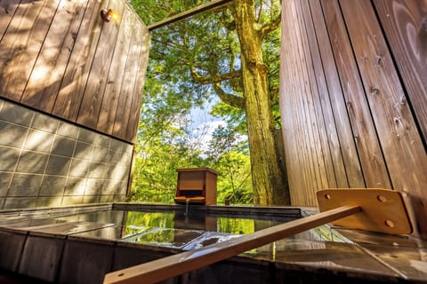 Executive Family Room with Hot Spring Open-Air Bath(Gyokoso) | Bathroom | Hair dryer, slippers, towels, soap