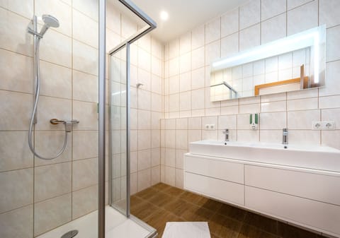 Comfort Suite, 2 Bedrooms, Balcony | Bathroom | Shower, hair dryer, towels, soap