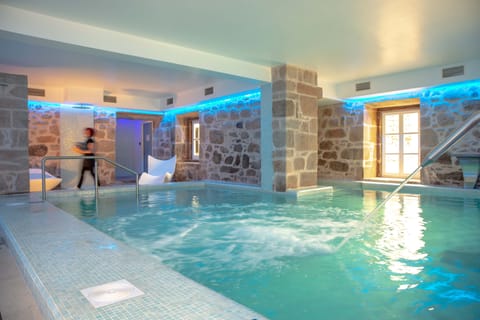 Indoor pool, seasonal outdoor pool, open 9 AM to 8 PM, pool umbrellas