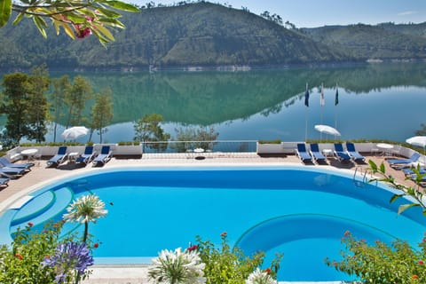 Outdoor pool, pool umbrellas, sun loungers