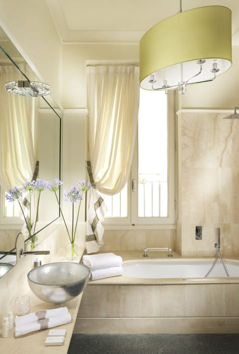 Designer toiletries, hair dryer, bidet, towels