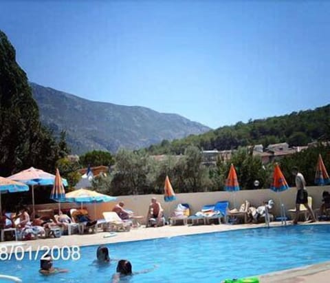 Seasonal outdoor pool, pool umbrellas, sun loungers