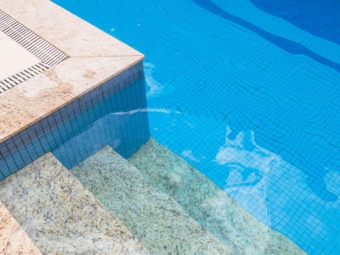 Outdoor pool, pool umbrellas, sun loungers