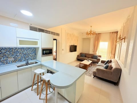 Suite, 1 Bedroom | Living room | 42-inch LCD TV with satellite channels, TV
