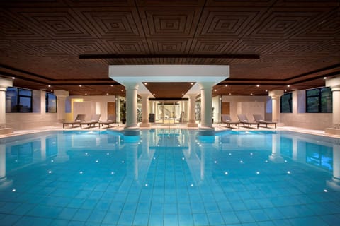 Indoor pool, open 6:00 AM to 10:00 PM, sun loungers