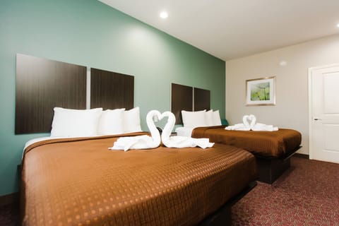 Down comforters, desk, laptop workspace, blackout drapes