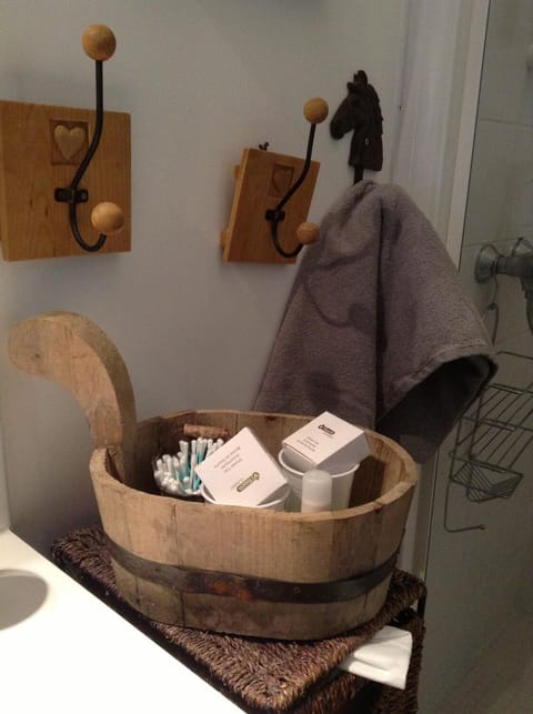 Shower, hair dryer, slippers, towels