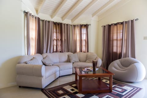 Family Villa, 2 Bedrooms | Living room | 50-inch flat-screen TV with cable channels, TV, DVD player