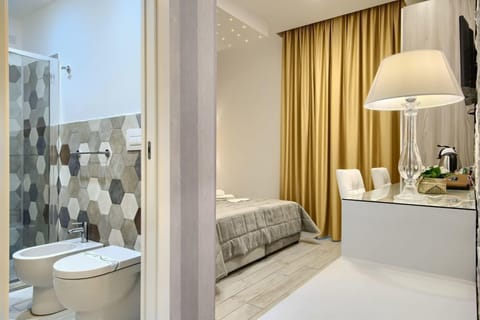 Superior Double or Twin Room | Minibar, in-room safe, blackout drapes, iron/ironing board