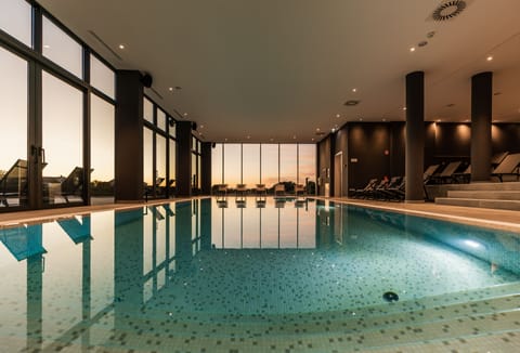 Indoor pool, outdoor pool, pool umbrellas, sun loungers
