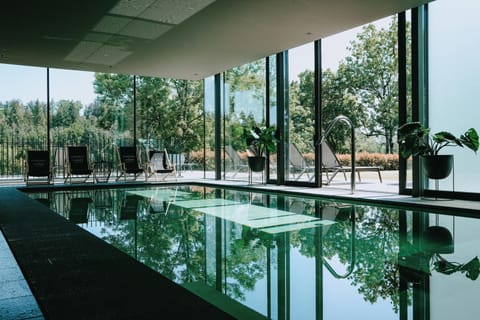 Indoor pool, open 8:00 AM to 8:00 PM, pool umbrellas, sun loungers