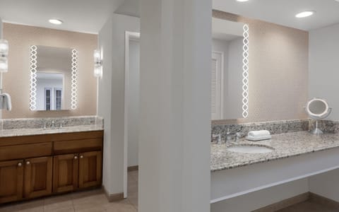 Shower, designer toiletries, hair dryer, towels