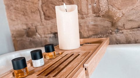 Luxury Suite, Sauna | Bathroom | Combined shower/tub, free toiletries, hair dryer, towels