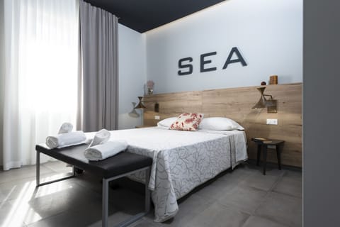 Standard Double Room | Minibar, individually furnished, desk, blackout drapes