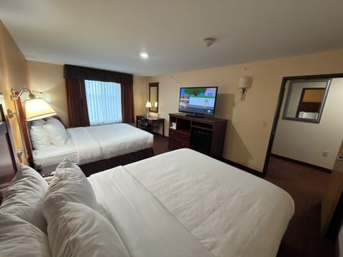 Suite, 2 Queen Beds, Kitchenette | Desk, laptop workspace, iron/ironing board, free WiFi