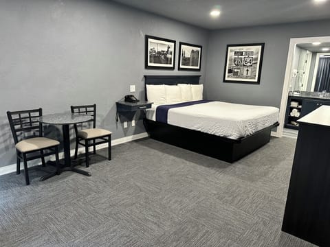 Deluxe Room, 1 King Bed | Desk, blackout drapes, iron/ironing board, free WiFi