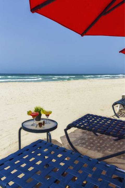 On the beach, white sand, free beach cabanas, sun loungers