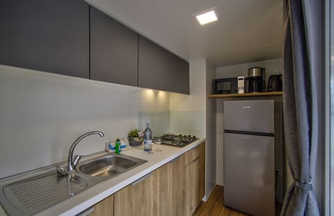 Comfort Mobile Home, 2 Bedrooms | Private kitchen | Full-size fridge, stovetop, electric kettle, highchair