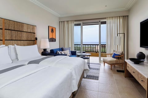 Premium bedding, down comforters, minibar, in-room safe