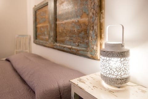 Apartment, 1 Bedroom, Garden View (Sale e Pepe) | Minibar, individually decorated, desk, blackout drapes