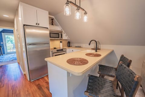 Apartment, 1 Queen Bed with Sofa bed, Non Smoking, Pool View | Living area | 38-inch Smart TV with digital channels, books, stereo