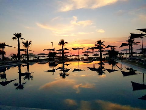 Indoor pool, 2 outdoor pools, open 7:00 AM to 6:00 PM, pool umbrellas