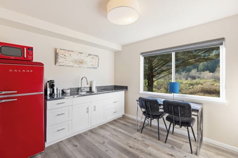 Deluxe Suite, 2 Queen Beds, Patio | Private kitchen | Fridge, microwave, coffee/tea maker, cookware/dishes/utensils