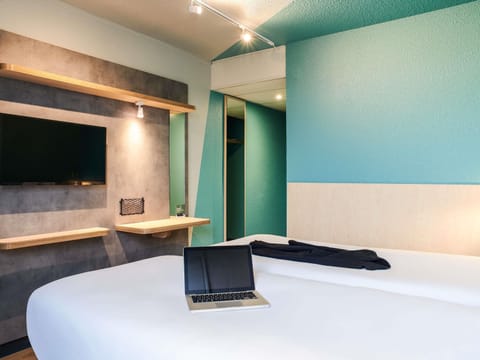 Hypo-allergenic bedding, desk, laptop workspace, blackout drapes