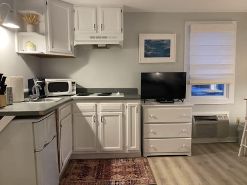 Fridge, microwave, coffee/tea maker, paper towels