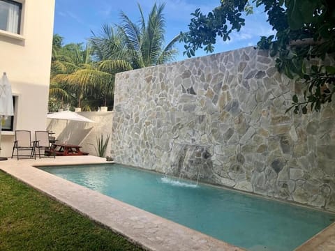 Outdoor pool, open 7:00 AM to 11:00 PM, pool umbrellas, sun loungers