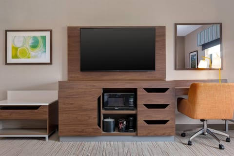 Premium bedding, desk, laptop workspace, blackout drapes