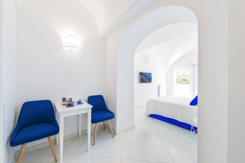 Basic Room, Private Bathroom | Living area | Flat-screen TV