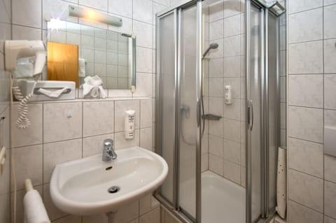 Shower, free toiletries, hair dryer, towels