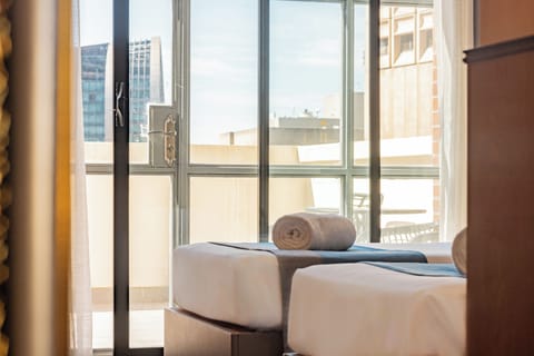 Signature Twin Room, Balcony, City View | Minibar, in-room safe, blackout drapes, iron/ironing board
