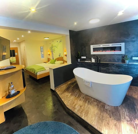 Junior Suite | Living area | 28-inch flat-screen TV with cable channels, TV, toys