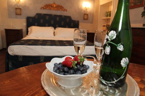 Deluxe Suite, 1 King Bed | 1 bedroom, minibar, in-room safe, individually decorated