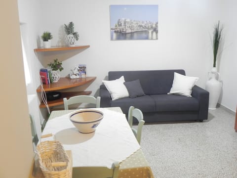 Apartment, 2 Bedrooms, Patio | Living area | 30-inch Smart TV with satellite channels, TV