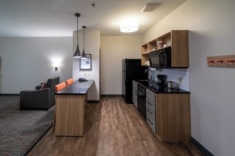Suite, 1 Bedroom | Desk, blackout drapes, iron/ironing board, free WiFi