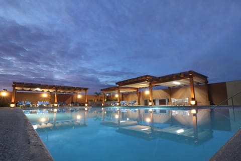Outdoor pool, open 8:00 AM to 10:00 PM, pool umbrellas, sun loungers