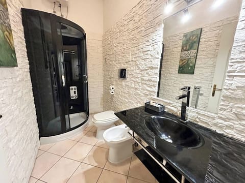 Deluxe Double Room, Multiple Beds, City View | Bathroom | Shower, free toiletries, hair dryer, slippers