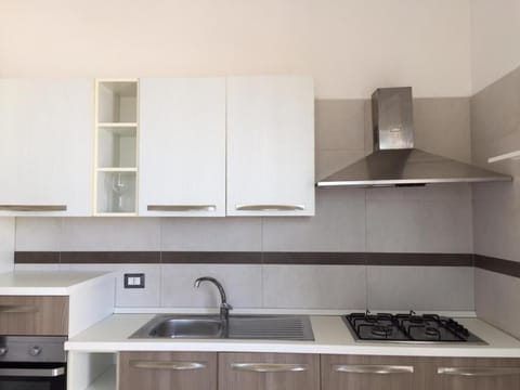 Deluxe Suite | Private kitchen | Full-size fridge, stovetop, dishwasher, toaster