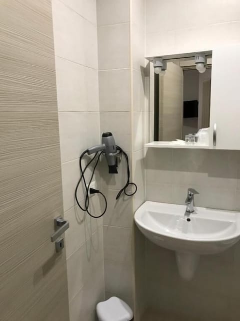 Shower, free toiletries, hair dryer, slippers