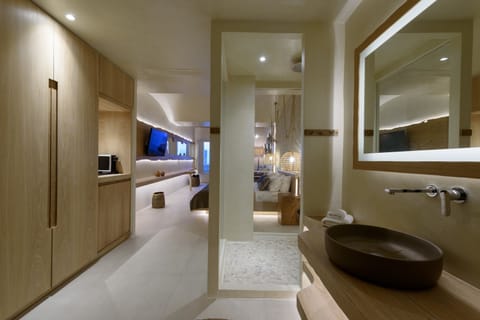 Luxury Suite, Hot Tub, Sea View | Bathroom amenities | Shower, rainfall showerhead, free toiletries, hair dryer