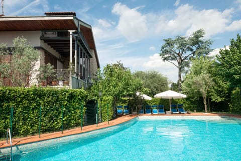 Seasonal outdoor pool, pool umbrellas, sun loungers