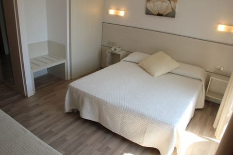 Triple Room, Balcony | In-room safe, individually furnished, desk, blackout drapes