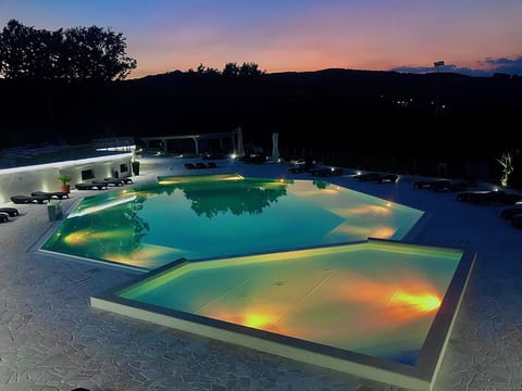 Seasonal outdoor pool, open 9:30 AM to 6:00 PM, pool umbrellas